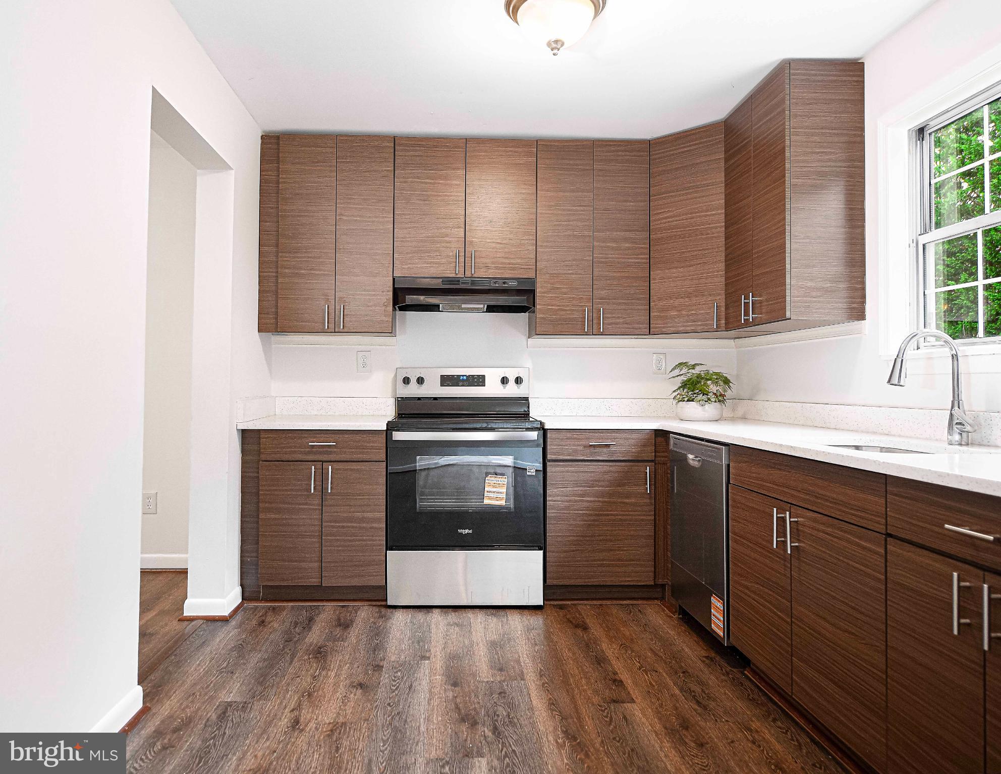 7105 Rutherford Green Circle Windsor Mill, MD 21244 - Photo 11 of 30 a kitchen with a sink a stove and cabinets