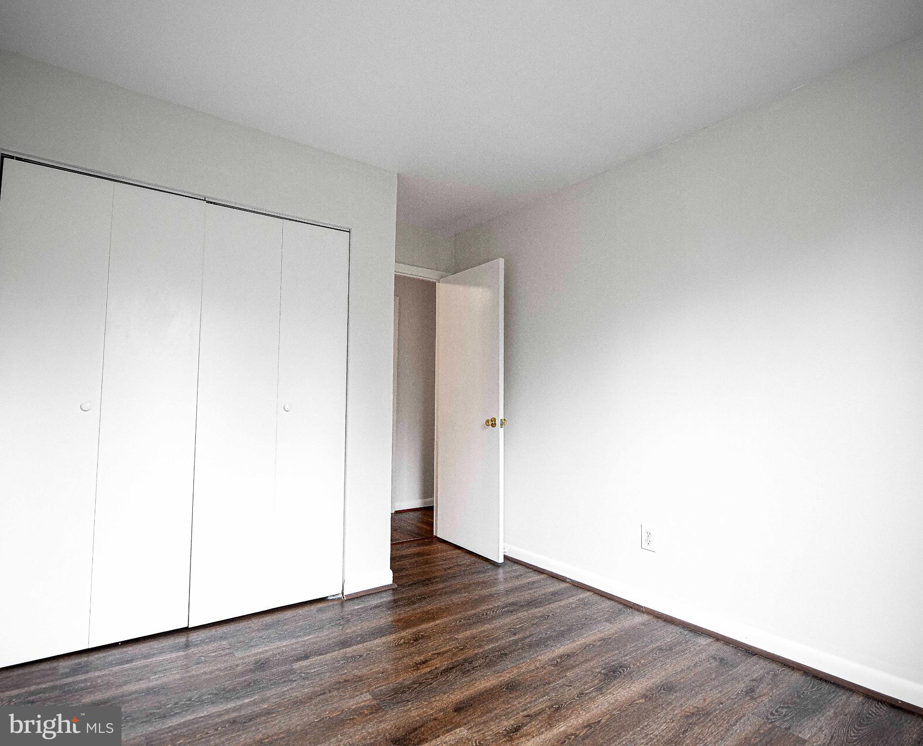 7105 Rutherford Green Circle Windsor Mill, MD 21244 - Photo 13 of 30 a view of an empty room with wooden floor