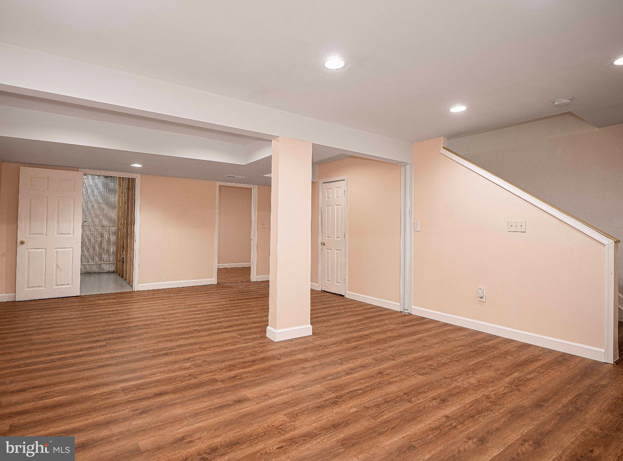7105 Rutherford Green Circle Windsor Mill, MD 21244 - Photo 21 of 30 a view of an empty room with wooden floor and closet