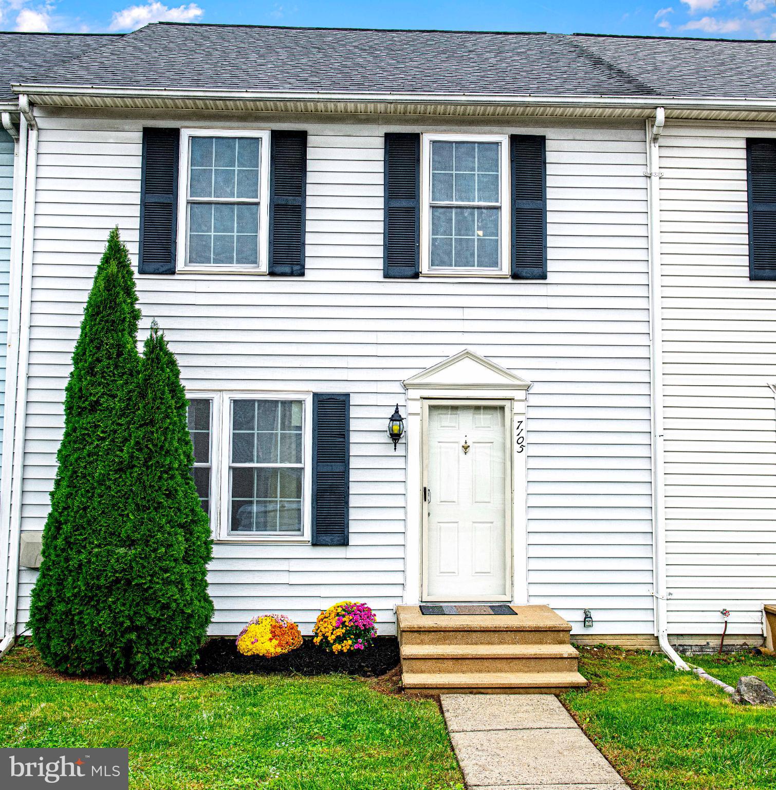 7105 Rutherford Green Circle Windsor Mill, MD 21244 - Photo 25 of 30 a front view of a house with garden