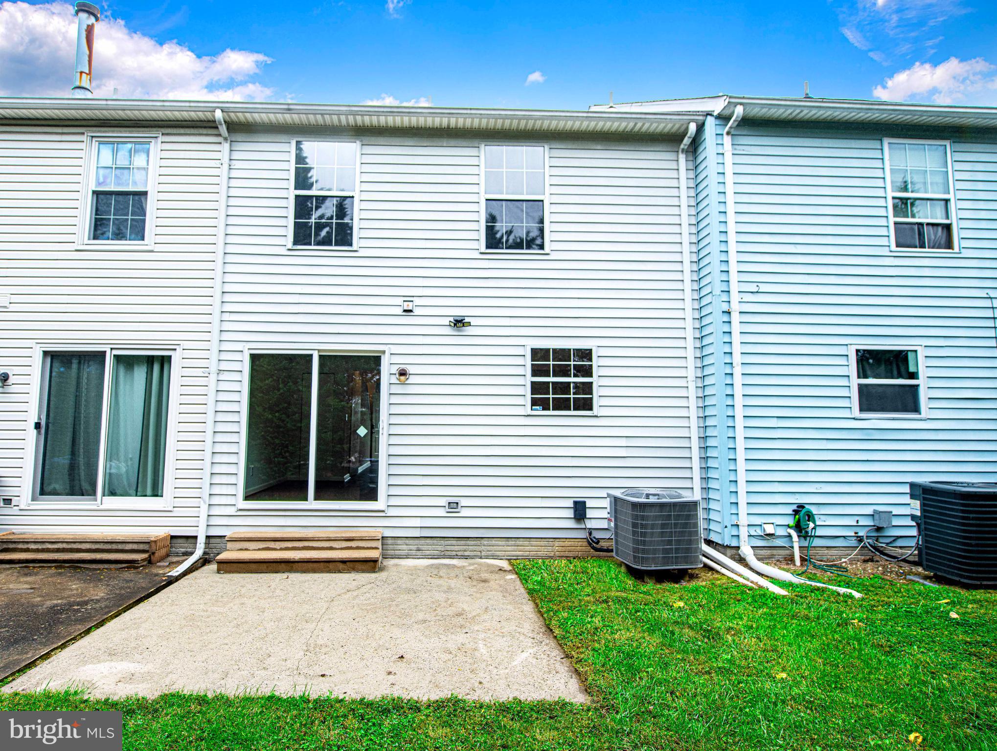 7105 Rutherford Green Circle Windsor Mill, MD 21244 - Photo 27 of 30 a view of a house with a yard and a garage
