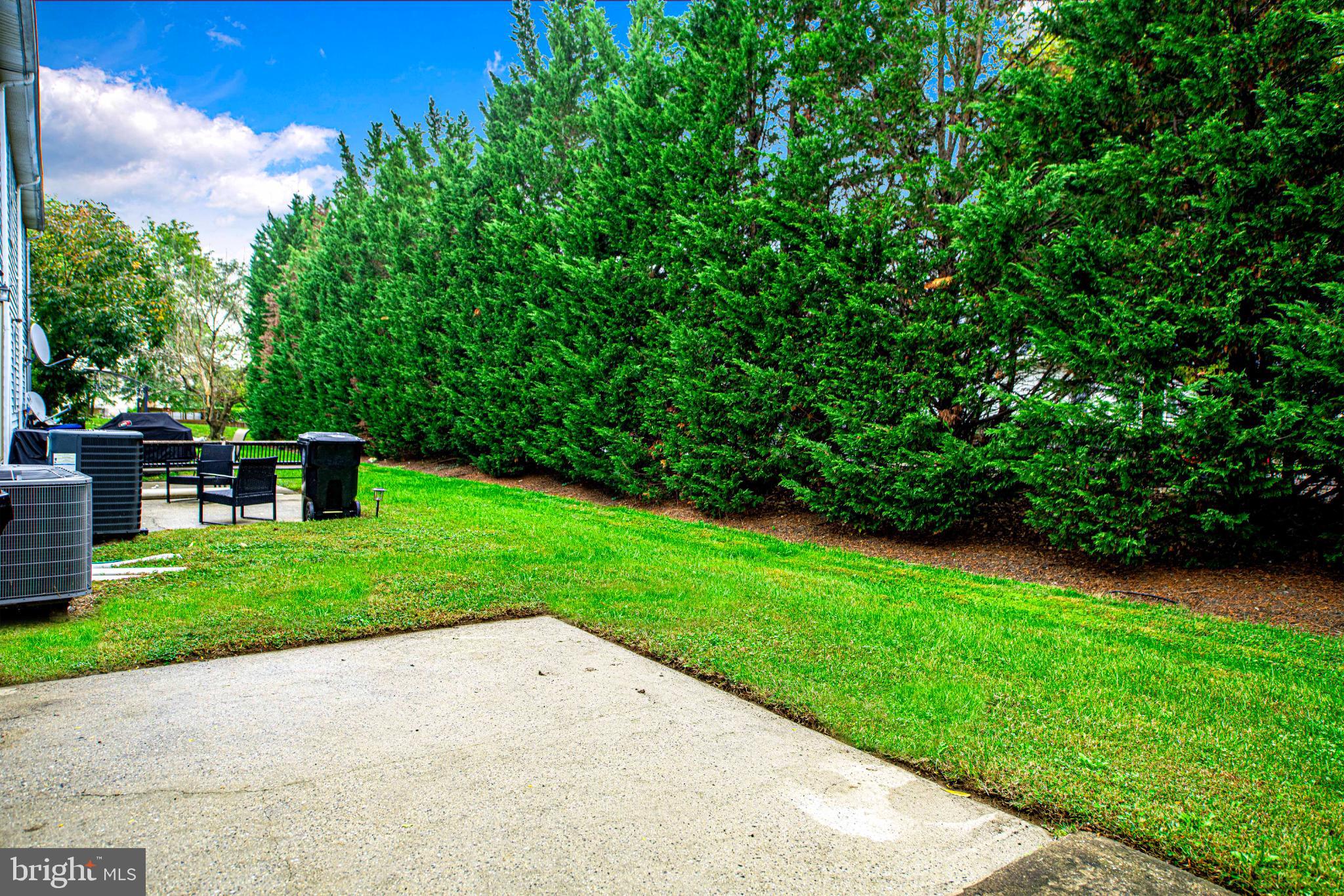 7105 Rutherford Green Circle Windsor Mill, MD 21244 - Photo 29 of 30 a view of a park with plants and a bench