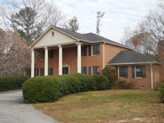 2033 Old Conyers Road Stockbridge, GA 30281 - Photo 1 of 1 a front view of a house with garden