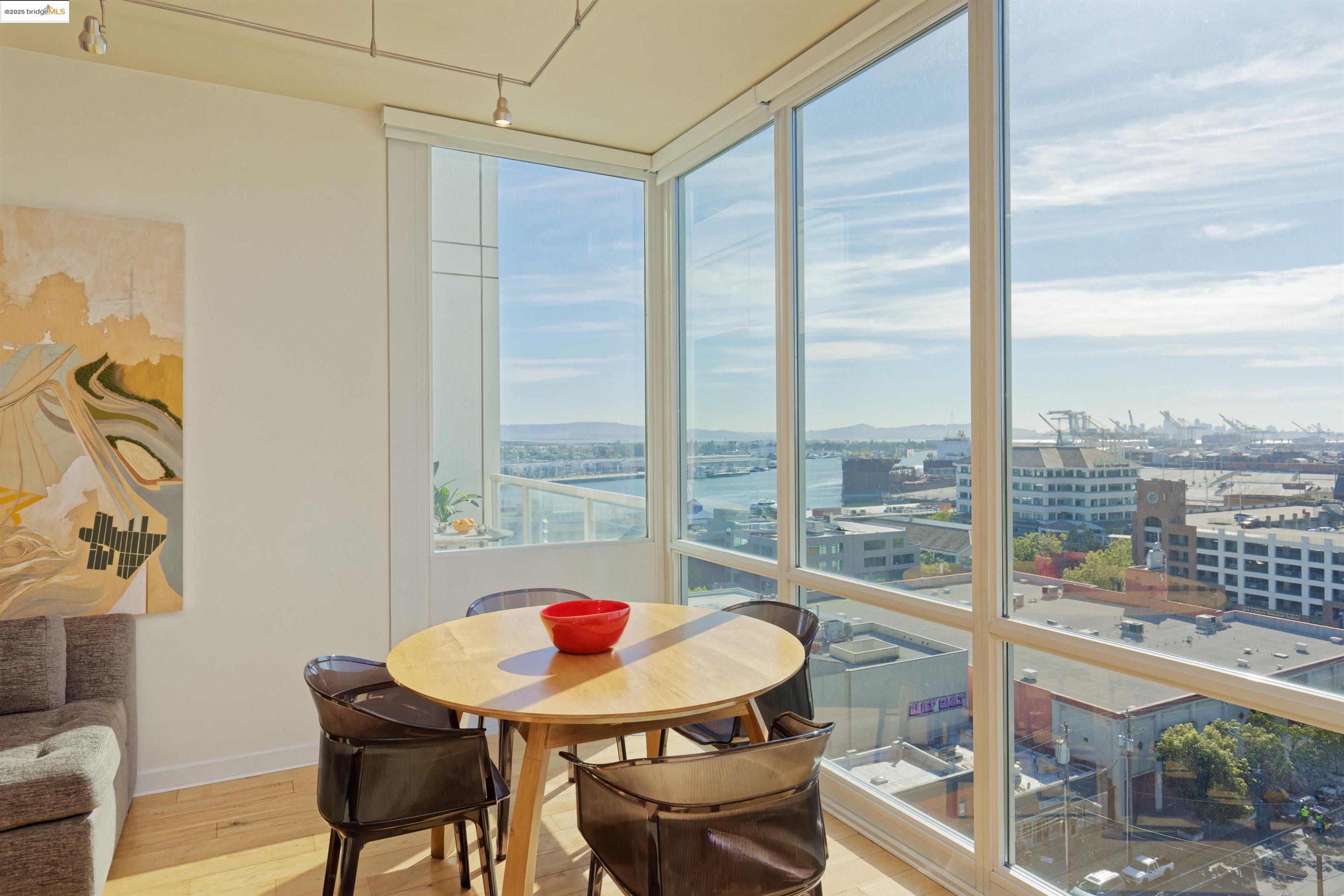 a view of a dining room with a table and chairs