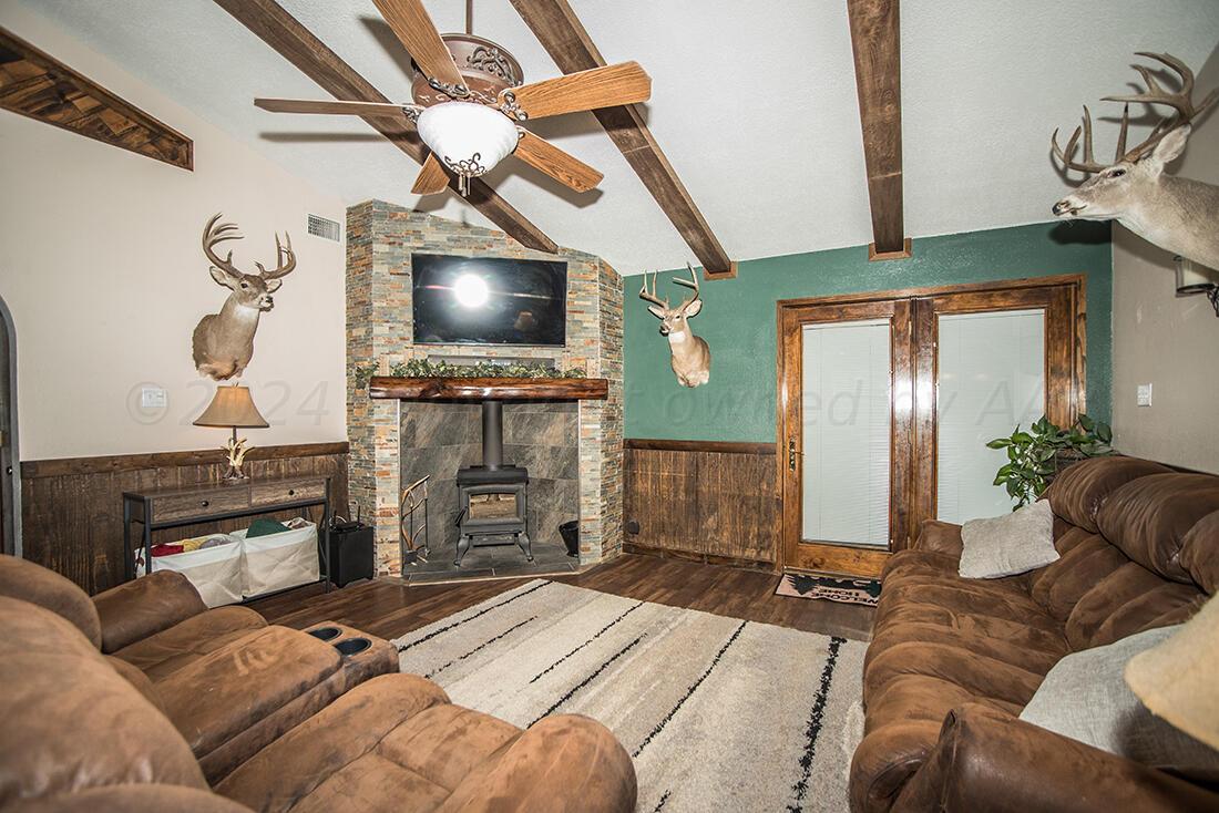 303 Cedar Fritch, TX 79036 - Photo 14 of 44 a bedroom with a bed and a television