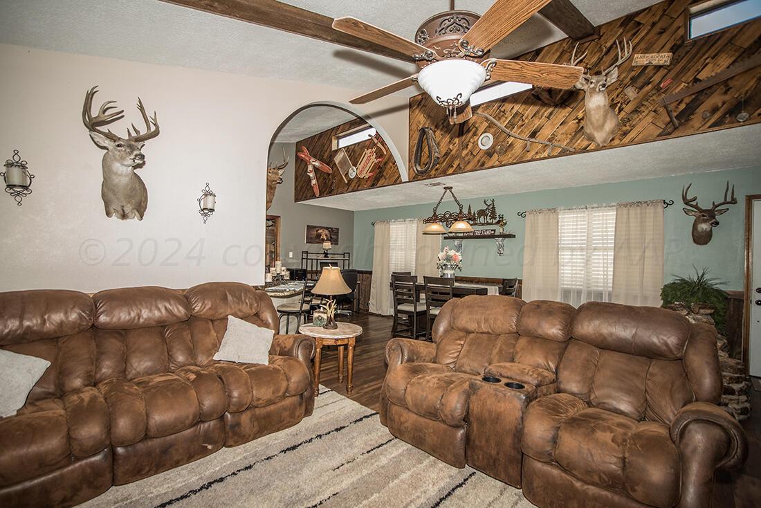 303 Cedar Fritch, TX 79036 - Photo 16 of 44 a living room with furniture and wooden floor