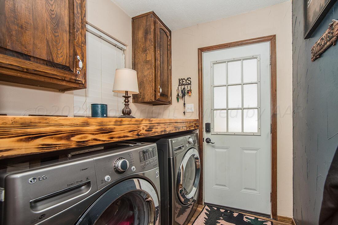 303 Cedar Fritch, TX 79036 - Photo 24 of 44 a view of a kitchen with a sink and a window