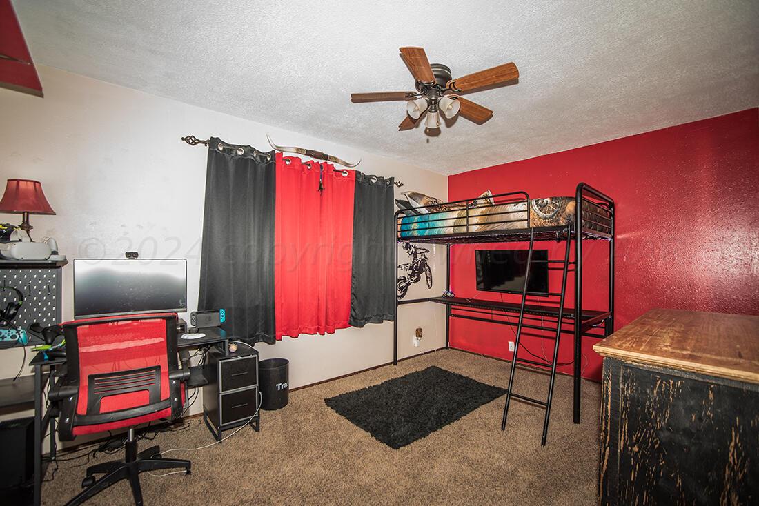 303 Cedar Fritch, TX 79036 - Photo 25 of 44 a living room with furniture and a flat screen tv