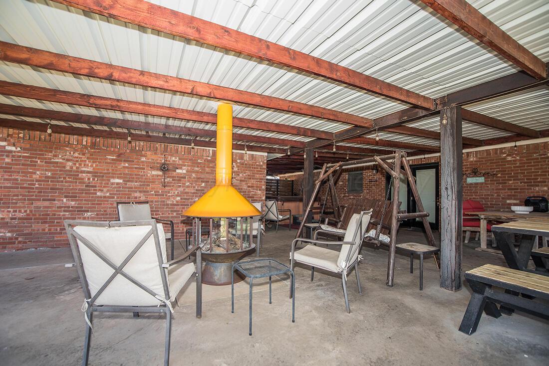303 Cedar Fritch, TX 79036 - Photo 30 of 44 a chair and tables in the patio
