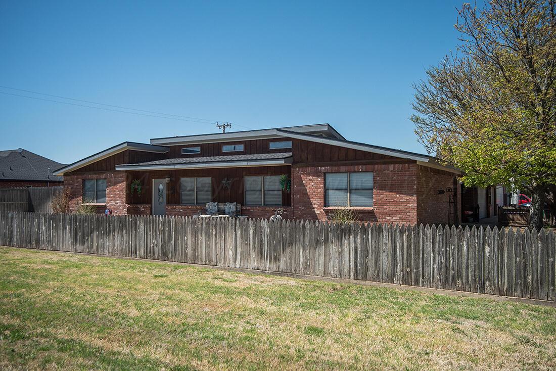 303 Cedar Fritch, TX 79036 - Photo 3 of 44 a front view of a house with a yard