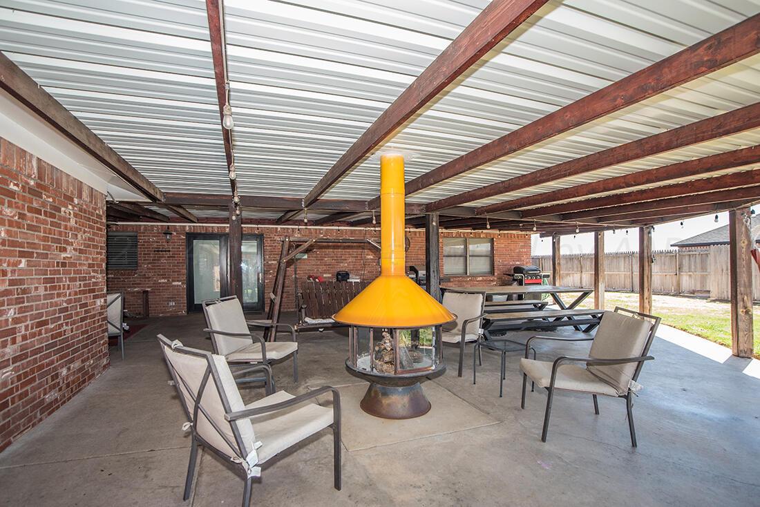 303 Cedar Fritch, TX 79036 - Photo 32 of 44 a view of a dining room with furniture and chandelier