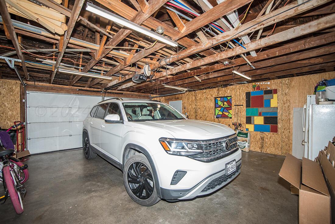 303 Cedar Fritch, TX 79036 - Photo 39 of 44 a car parked in a garage