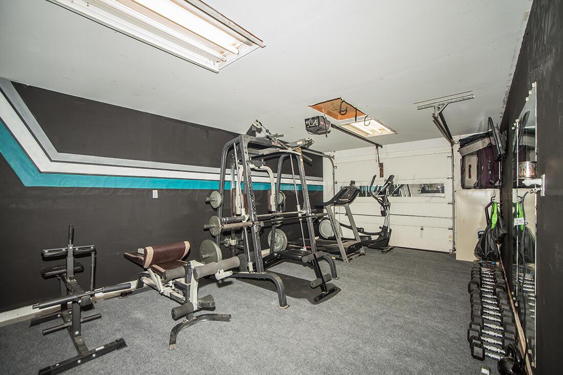 303 Cedar Fritch, TX 79036 - Photo 40 of 44 a view of a room with gym equipment