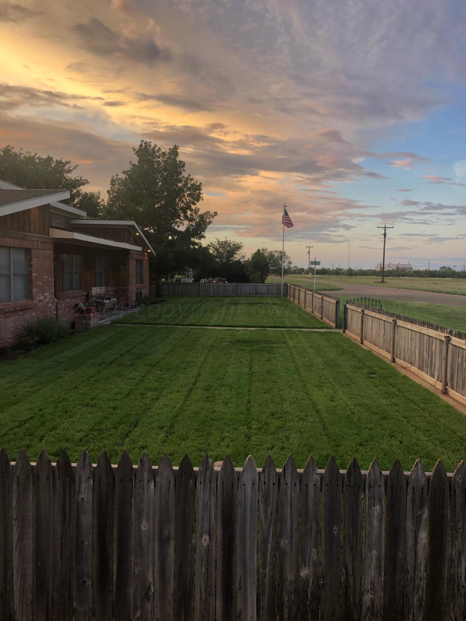 303 Cedar Fritch, TX 79036 - Photo 41 of 44 a view of a backyard with a garden