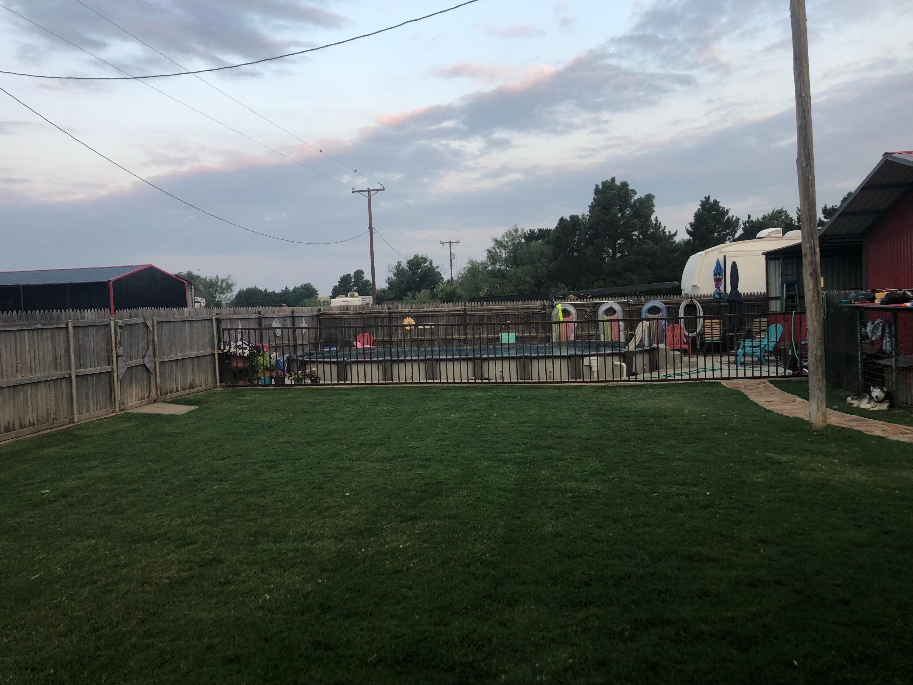 303 Cedar Fritch, TX 79036 - Photo 42 of 44 a view of a park with swings and slides