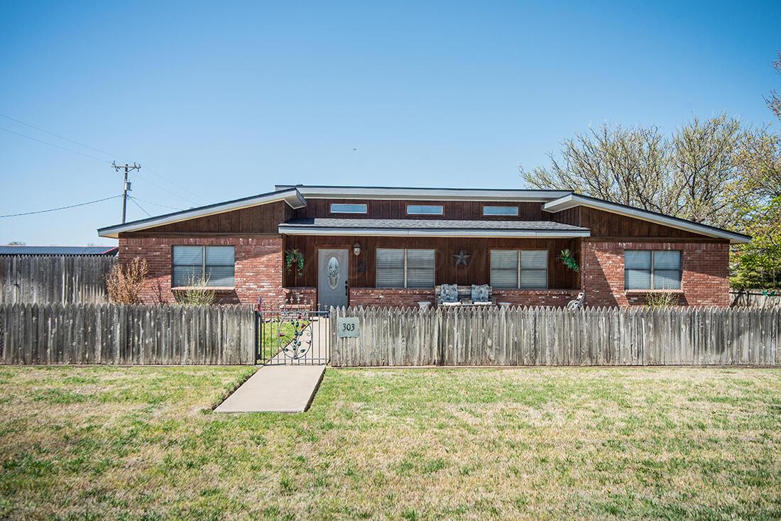 303 Cedar Fritch, TX 79036 - Photo 5 of 44 a view of a house with a yard