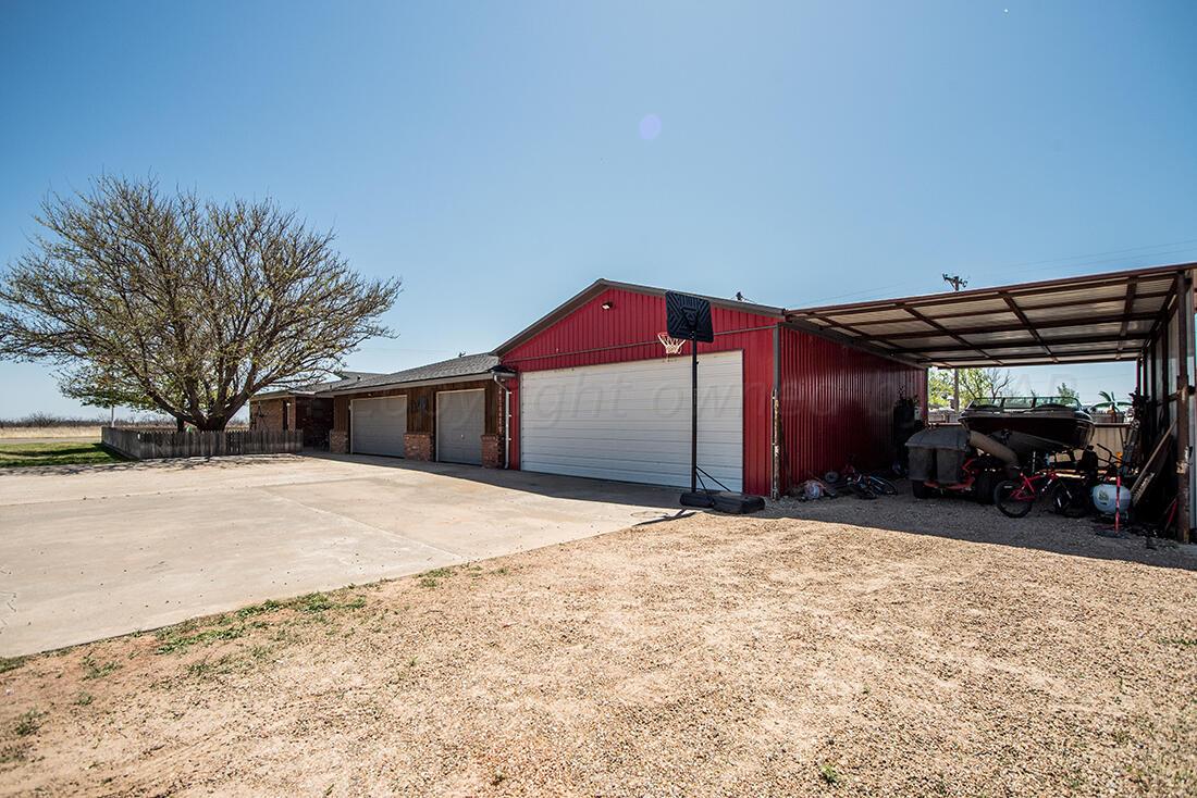 303 Cedar Fritch, TX 79036 - Photo 9 of 44 a house with trees in front of it