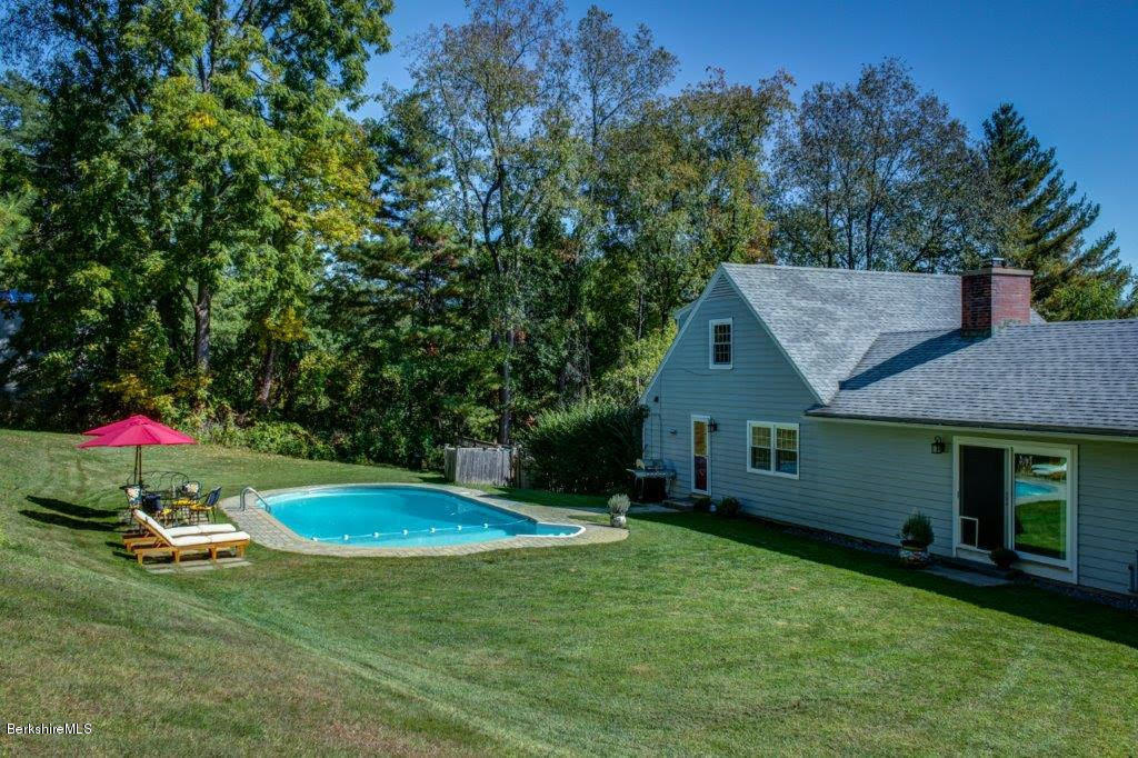 45 Buxton Hill Road Williamstown, MA 01267 - Photo 11 of 21 a backyard of a house with table and chairs