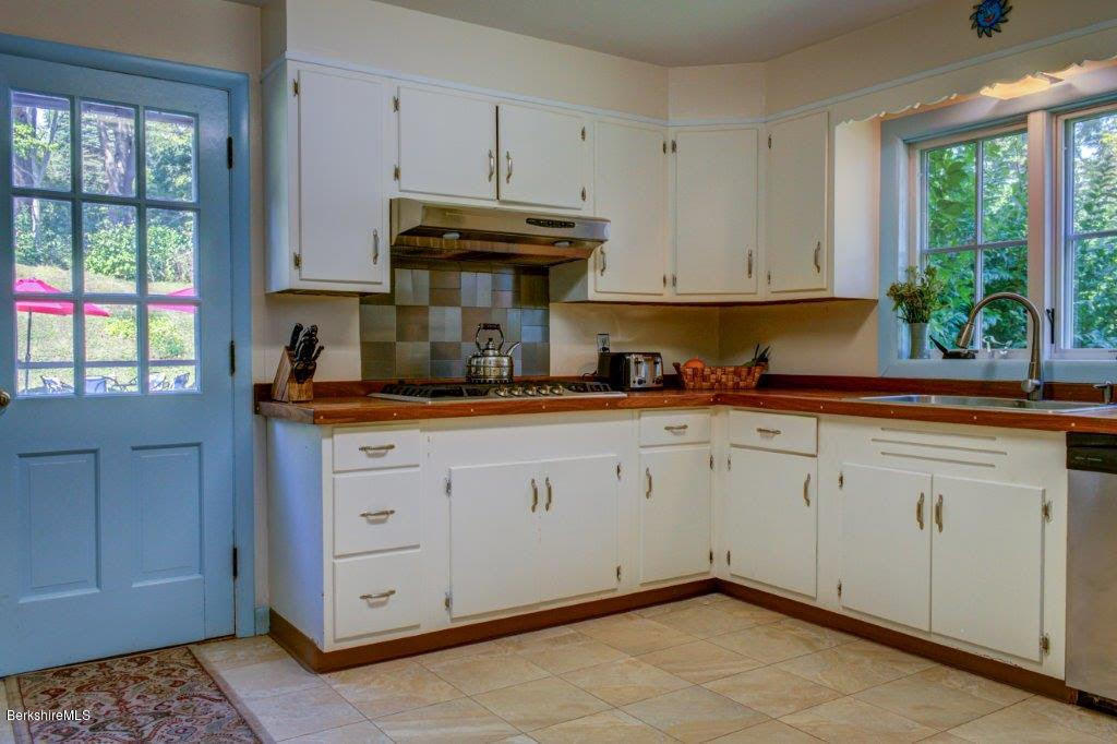 45 Buxton Hill Road Williamstown, MA 01267 - Photo 5 of 21 a kitchen with granite countertop a sink window and cabinets