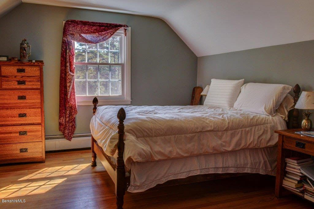 45 Buxton Hill Road Williamstown, MA 01267 - Photo 10 of 21 a bed sitting in a bedroom next to a window