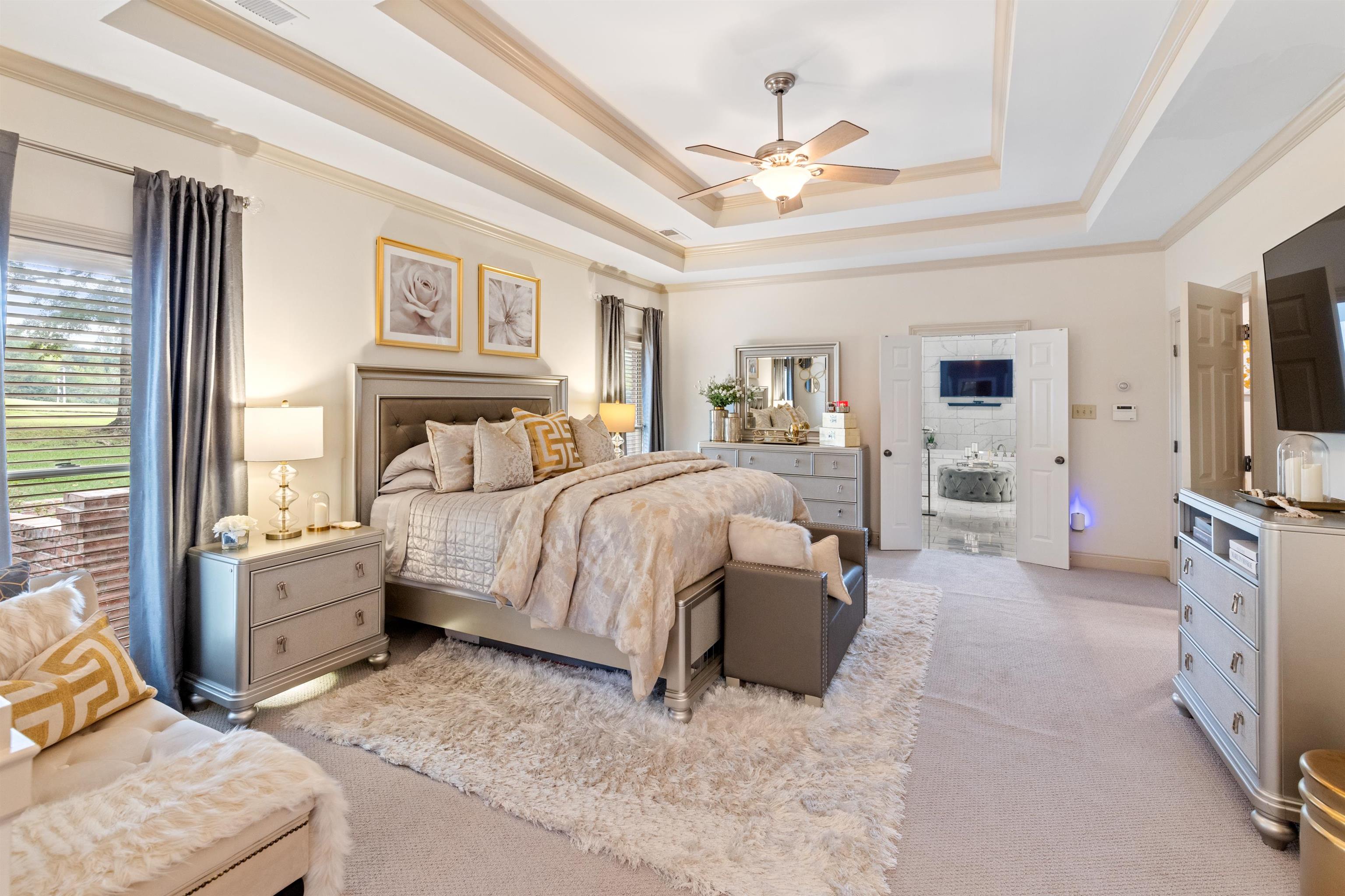 11241 Latting Road Eads, TN 38028 - Photo 20 of 31 Carpeted bedroom featuring ornamental molding, a tray ceiling, and ceiling fan