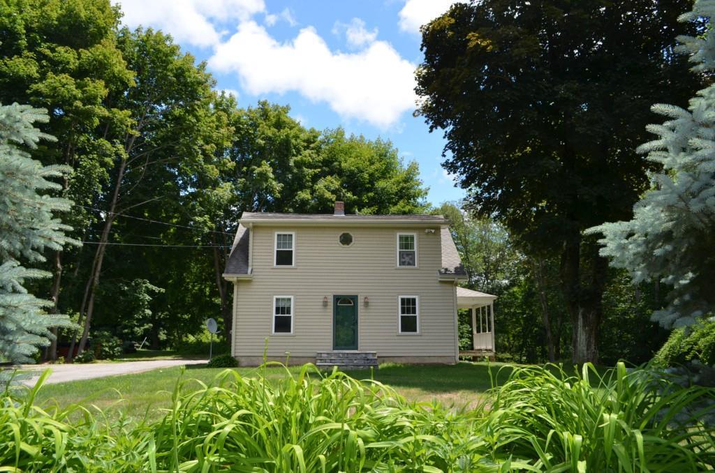 844 Amity Road Bethany, CT 06524 - Photo 1 of 1 a house with trees in front of it