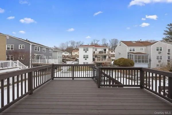 a view of a balcony with wooden fence