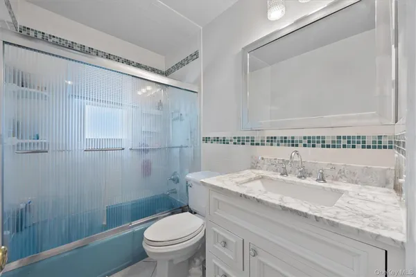 a living room with couch and a large window