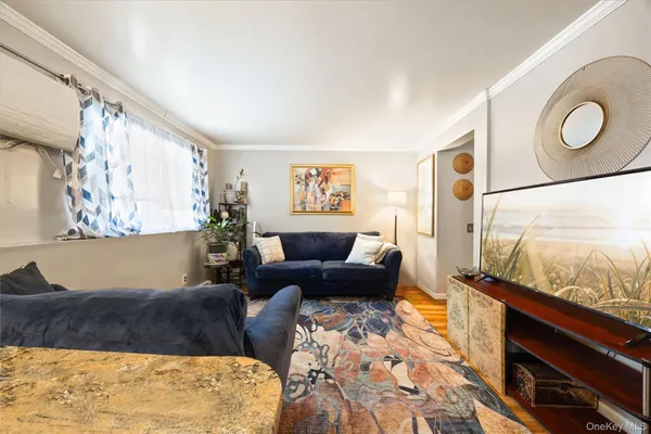 a view of a hallway with seating space