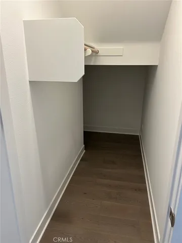 a view of an empty room with closet area