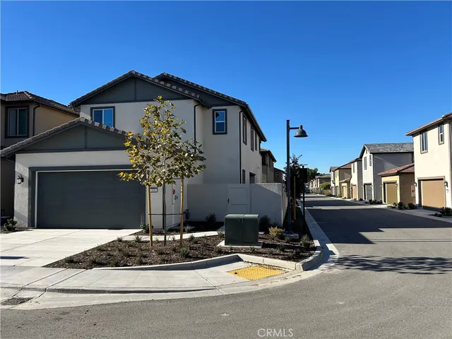 a front view of a house with sitting space