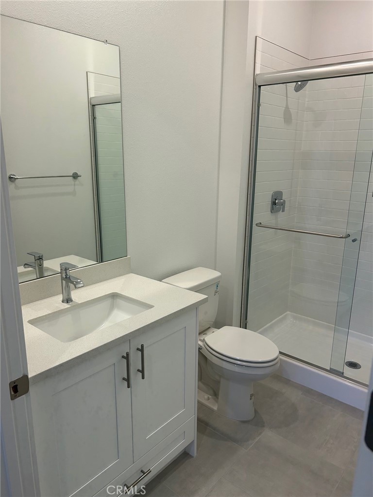 168 Carmine Irvine, CA 92618 - Photo 8 of 26 a bathroom with a sink toilet and shower