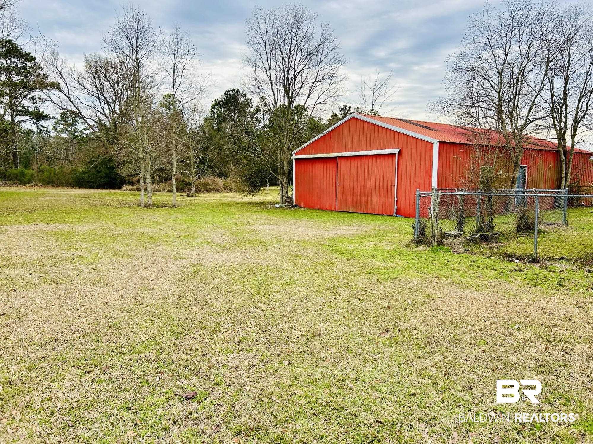 13551 Gaston Loop Road Grand Bay, AL 36541 - Photo 9 of 15 View of yard with an outbuilding