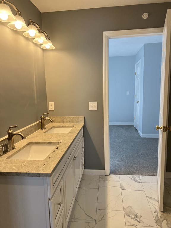 16 B Taunton Street Worcester, MA 01604 - Photo 11 of 12 a bathroom with a sink and a mirror
