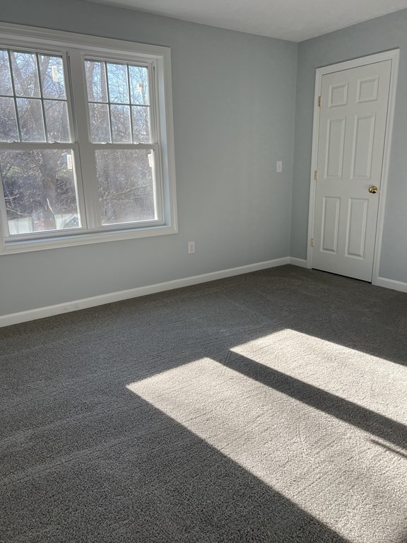 16 B Taunton Street Worcester, MA 01604 - Photo 9 of 12 an empty room with wooden floor and windows