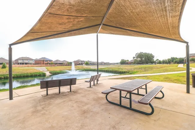 a view of outdoor space with swimming pool and furniture