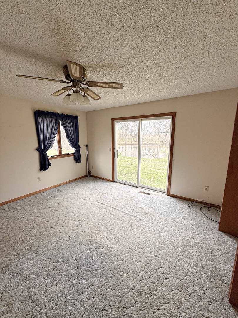 1599 East 2700 North Road Clifton, IL 60927 - Photo 17 of 26 a view of an empty room with a window