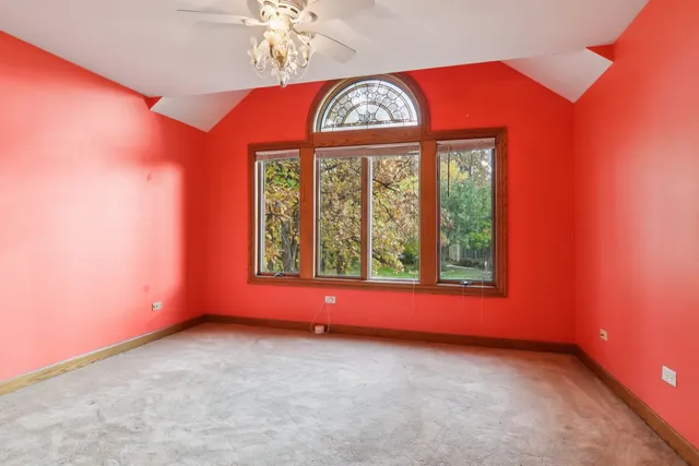 a view of a livingroom with a chandelier fan