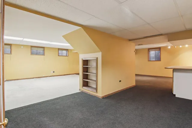 a view of a house with wooden floor and wooden fence