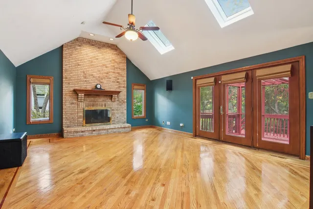 a large kitchen with kitchen island granite countertop a large counter top and stainless steel appliances