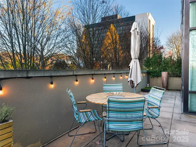 a table and chairs in front of a house