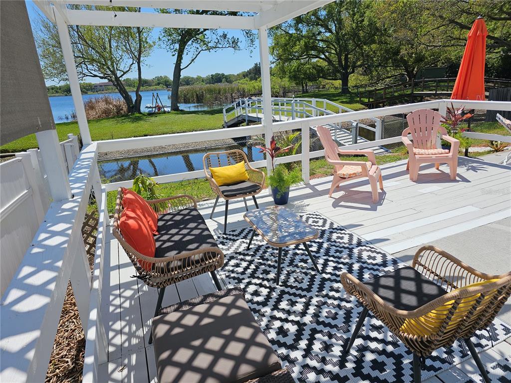 2153 Karan Way Clearwater, FL 33763 - Photo 49 of 65 a view of an outdoor sitting area with furniture and garden view