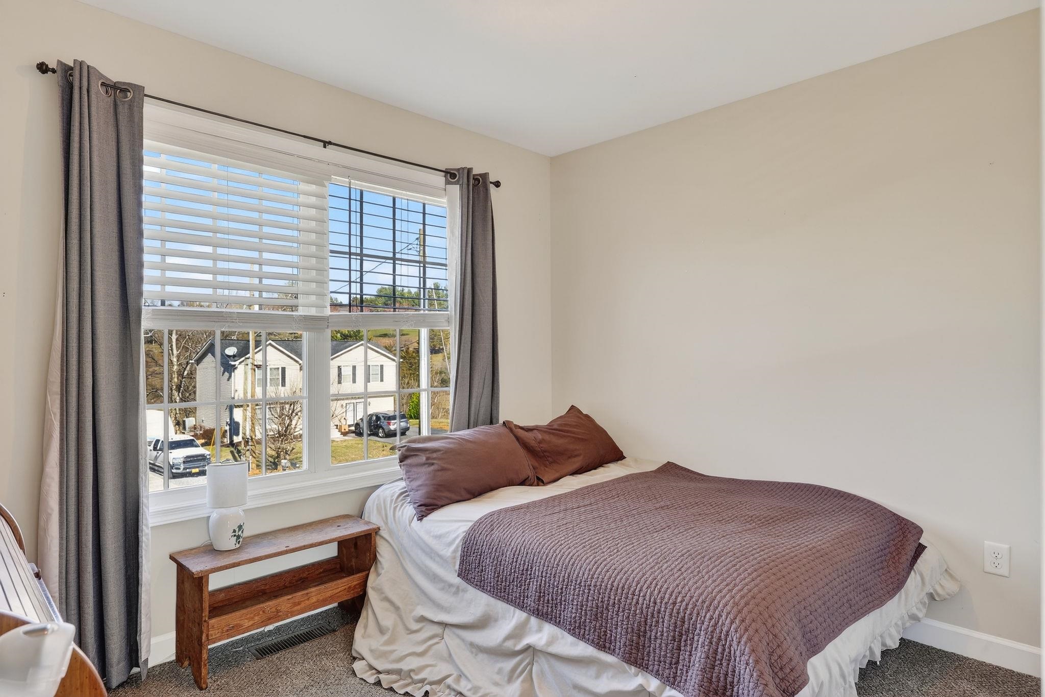 235 Locustdale Loop Shenandoah, VA 22849 - Photo 16 of 30 a bedroom with a bed and a large window