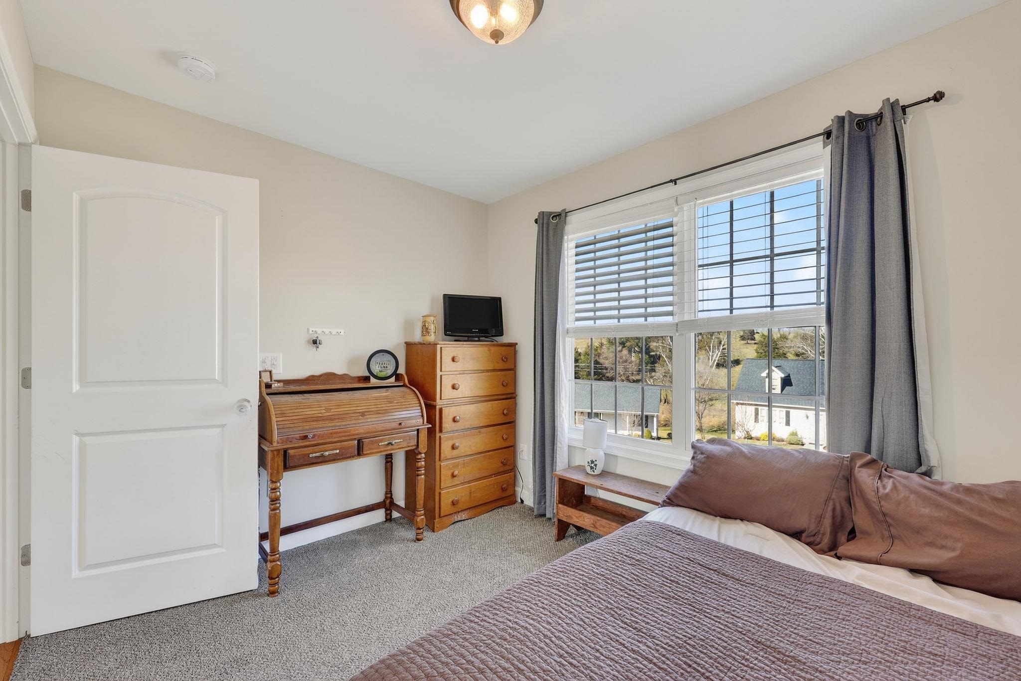 235 Locustdale Loop Shenandoah, VA 22849 - Photo 17 of 30 a bedroom with a bed and wooden floor