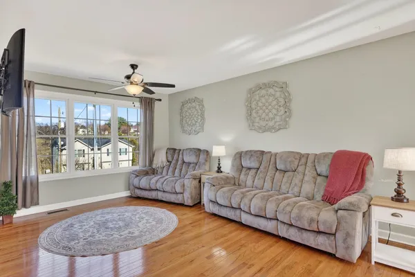 a living room with furniture and a large window