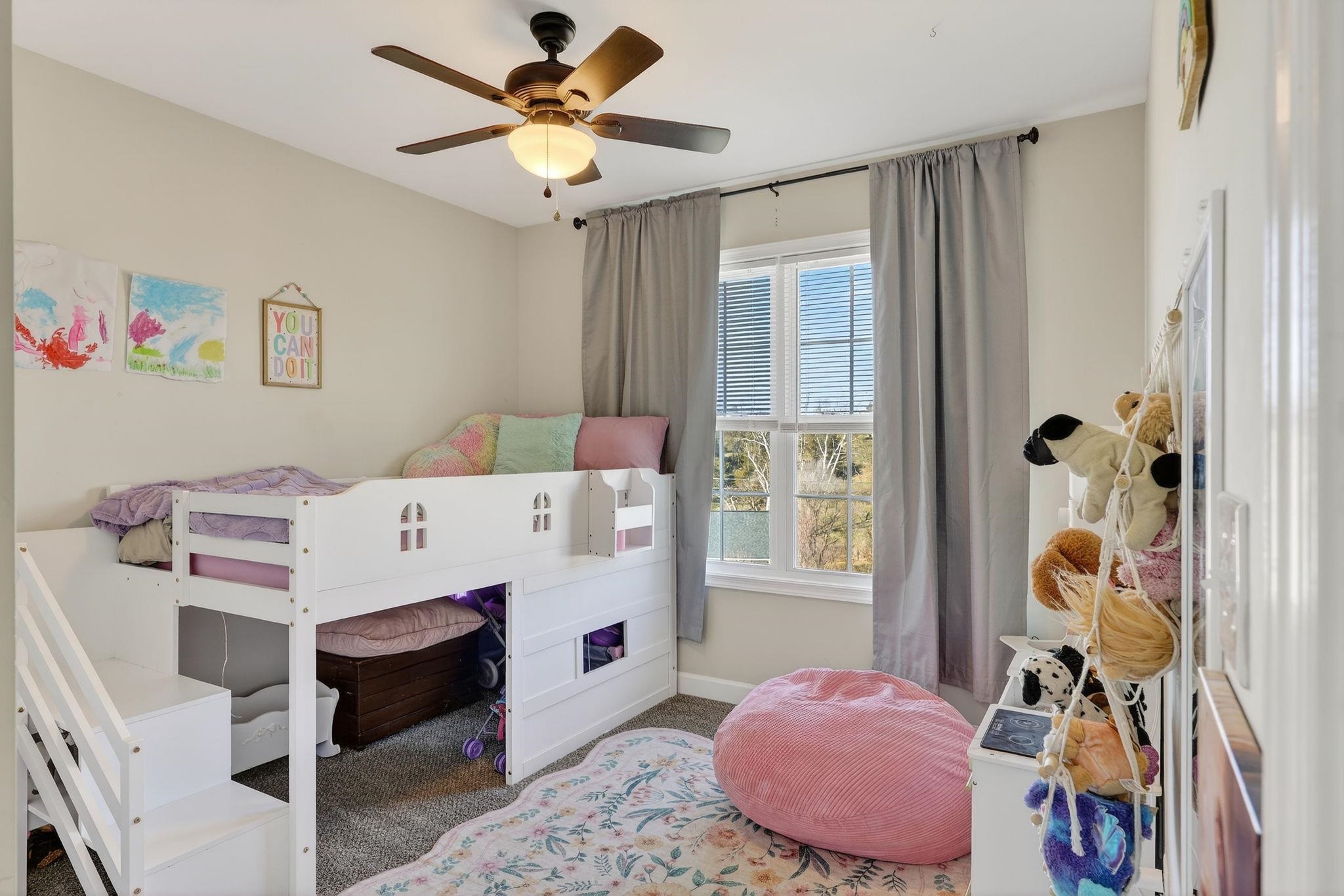 235 Locustdale Loop Shenandoah, VA 22849 - Photo 7 of 30 a bedroom with a bed and a chandelier