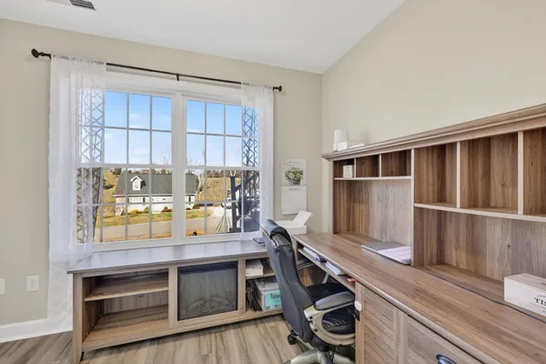 a kitchen with a stove and a refrigerator