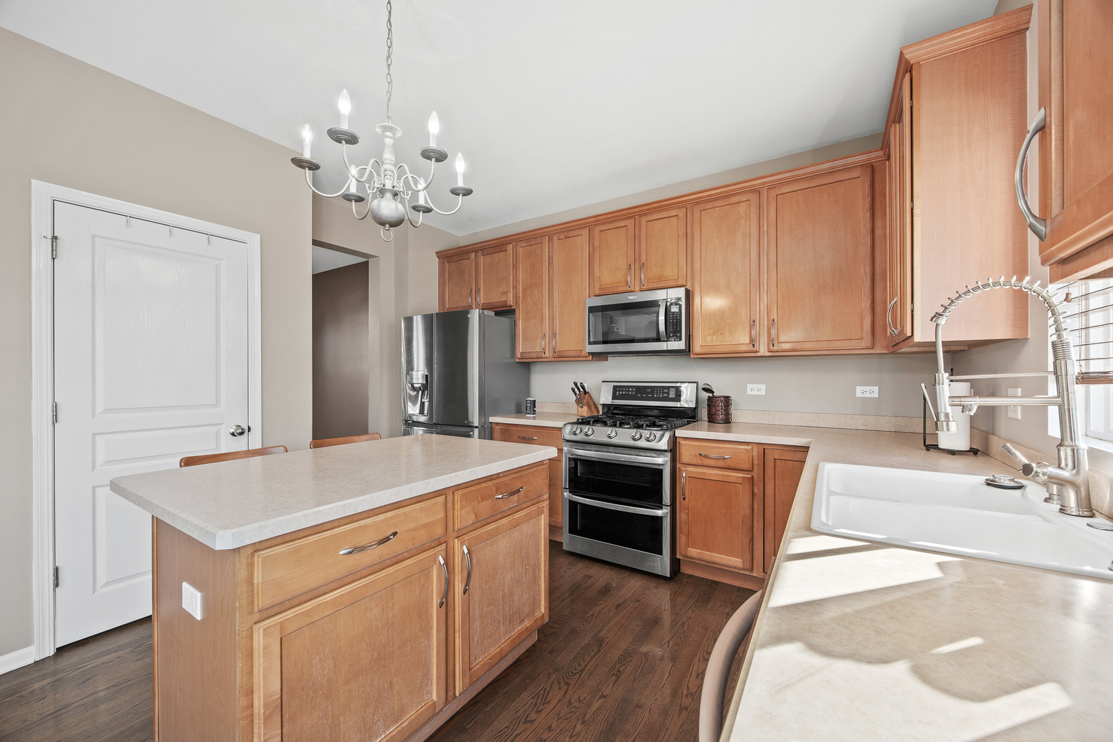 133 North Cranberry Street Bolingbrook, IL 60490 - Photo 14 of 46 a kitchen with a sink stove and refrigerator