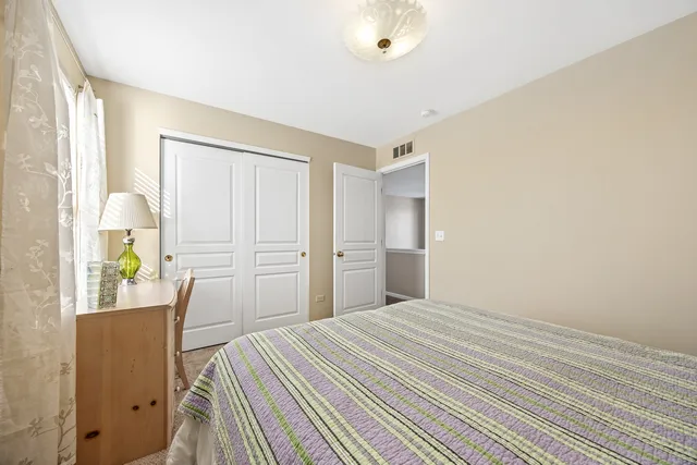 a view of work space with furniture and windows