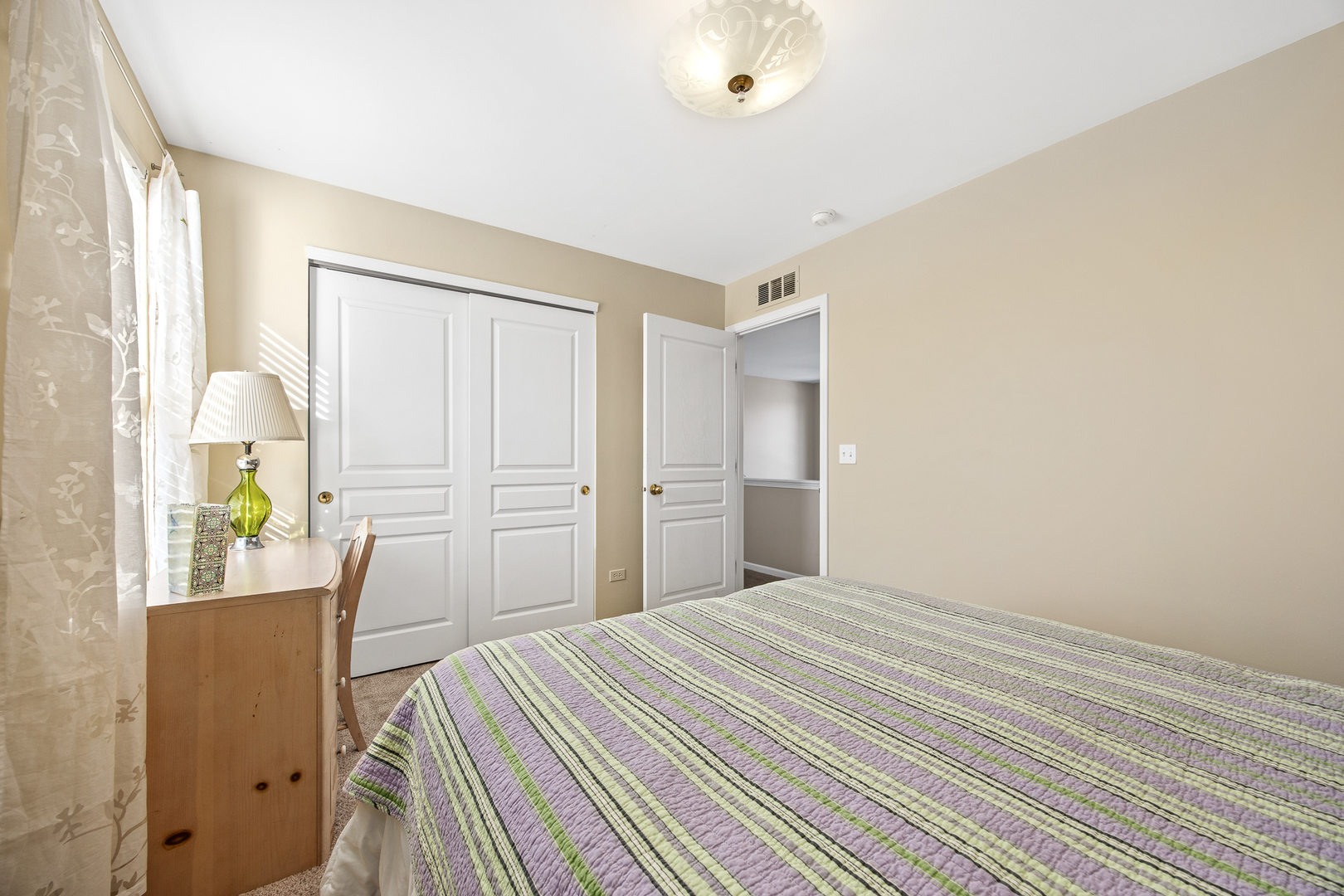 133 North Cranberry Street Bolingbrook, IL 60490 - Photo 31 of 46 a bedroom with a bed dresser and a window